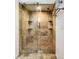 Large walk-in shower with glass enclosure and tiled walls at 16290 Sw 17Th Ave, Ocala, FL 34473