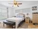 Main bedroom with ceiling fan, large window, and tiled floors at 16290 Sw 17Th Ave, Ocala, FL 34473