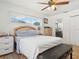Main bedroom with a ceiling fan and ensuite bathroom access at 16290 Sw 17Th Ave, Ocala, FL 34473