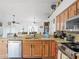 Open kitchen with stainless steel appliances and granite countertops at 16290 Sw 17Th Ave, Ocala, FL 34473