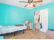 Bedroom with teal walls and ceiling fan at 16290 Sw 17Th Ave, Ocala, FL 34473