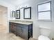 Updated bathroom with double vanity and granite countertop at 16290 Sw 17Th Ave, Ocala, FL 34473
