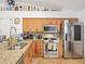 Spacious kitchen with stainless steel appliances and granite countertops at 16290 Sw 17Th Ave, Ocala, FL 34473
