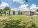 House exterior with large yard and driveway at 16290 Sw 17Th Ave, Ocala, FL 34473