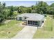 Single-story house with a screened-in garage and a spacious yard at 16290 Sw 17Th Ave, Ocala, FL 34473