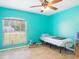 Bedroom with teal walls and ceiling fan at 16290 Sw 17Th Ave, Ocala, FL 34473