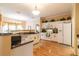 Spacious kitchen with white cabinets, granite countertops, and stainless steel appliances at 2291 Nw 59Th Ter, Ocala, FL 34482