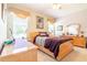 Well-lit bedroom with king bed and plenty of furniture at 2291 Nw 59Th Ter, Ocala, FL 34482