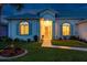 Well lit exterior of home at night at 2291 Nw 59Th Ter, Ocala, FL 34482