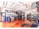 Spacious garage with metallic epoxy flooring, overhead storage, and workbench at 2291 Nw 59Th Ter, Ocala, FL 34482