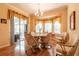 Dining room with bay window, sliders to a patio, and hardwood floors at 2291 Nw 59Th Ter, Ocala, FL 34482