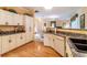 This kitchen offers white cabinets, granite countertops, and a double sink at 2291 Nw 59Th Ter, Ocala, FL 34482