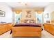 Spacious bedroom with a king-size bed and ample dresser space at 2291 Nw 59Th Ter, Ocala, FL 34482