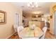 Bright dining room with a light wood table and chairs, and access to the kitchen at 2291 Nw 59Th Ter, Ocala, FL 34482