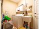 Laundry room with washer, dryer, utility sink, and ample cabinet storage at 2291 Nw 59Th Ter, Ocala, FL 34482