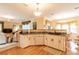 Kitchen boasts a breakfast bar, ample counter space, and views into the living room at 2291 Nw 59Th Ter, Ocala, FL 34482