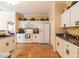 White kitchen with ample storage and stainless steel appliances at 2291 Nw 59Th Ter, Ocala, FL 34482