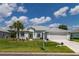 Front view of a single-story house with a two-car garage at 2291 Nw 59Th Ter, Ocala, FL 34482