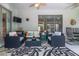Relaxing patio with seating area and rug, offering a comfortable outdoor space at 2291 Nw 59Th Ter, Ocala, FL 34482