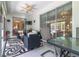 Enclosed patio with seating area and view of backyard at 2291 Nw 59Th Ter, Ocala, FL 34482