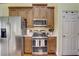Kitchen with stainless steel appliances and wood cabinets at 4320 Se 106Th St, Belleview, FL 34420
