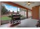 Relaxing screened porch, complete with a Blackstone grill and backyard view at 4320 Se 106Th St, Belleview, FL 34420