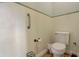 Small half bathroom with toilet and grab bar at 4320 Se 106Th St, Belleview, FL 34420