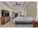 Spacious main bedroom with large bed, dresser, and TV at 4320 Se 106Th St, Belleview, FL 34420