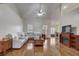 Spacious living room with hardwood floors, sectional sofa, and fireplace at 4320 Se 106Th St, Belleview, FL 34420