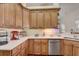Kitchen features wood cabinets, quartz countertops, and stainless steel appliances at 4320 Se 106Th St, Belleview, FL 34420