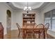 Formal dining room with a wooden table and hutch at 4320 Se 106Th St, Belleview, FL 34420