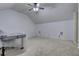 Bright bonus room featuring a ceiling fan and neutral wall colors at 4320 Se 106Th St, Belleview, FL 34420