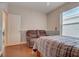 Spacious bedroom with a comfortable recliner and large window at 4320 Se 106Th St, Belleview, FL 34420