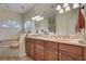 Bathroom boasts a double vanity, large soaking tub, and separate shower at 4320 Se 106Th St, Belleview, FL 34420