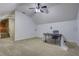 Spacious bonus room with carpeted floor and ceiling fan at 4320 Se 106Th St, Belleview, FL 34420