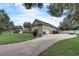 Single-story house with a two-car garage and a long driveway at 4320 Se 106Th St, Belleview, FL 34420
