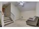 Spacious bonus room with ceiling fan and recliner at 4320 Se 106Th St, Belleview, FL 34420