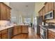 Kitchen with wood cabinets, stainless steel appliances and breakfast bar at 4320 Se 106Th St, Belleview, FL 34420