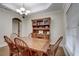 Formal dining room with wooden table, hutch, and hardwood floors at 4320 Se 106Th St, Belleview, FL 34420