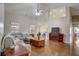 Large living room with hardwood floors, sectional sofa, and fireplace at 4320 Se 106Th St, Belleview, FL 34420