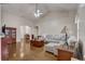 Spacious living room featuring hardwood floors, comfortable seating, and a ceiling fan at 4320 Se 106Th St, Belleview, FL 34420