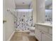 Well-lit bathroom, featuring a shower/tub combo and double vanity at 4320 Se 106Th St, Belleview, FL 34420