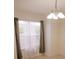 Bright dining area with large window and elegant chandelier at 535 W Silver Springs Pl, Ocala, FL 34475