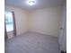 Spacious bedroom with light walls and tile flooring at 535 W Silver Springs Pl, Ocala, FL 34475