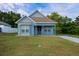 Charming light blue house with front porch at 535 W Silver Springs Pl, Ocala, FL 34475