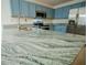 Granite countertop kitchen island with stainless steel sink and faucet at 535 W Silver Springs Pl, Ocala, FL 34475