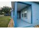 Front porch of light blue house at 535 W Silver Springs Pl, Ocala, FL 34475