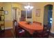 Formal dining room with oval table and hardwood floors at 6895 Se 96Th Place Rd, Belleview, FL 34420