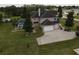 Aerial view showcasing the house's front and driveway at 6895 Se 96Th Place Rd, Belleview, FL 34420
