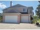 Two-car garage and manicured landscaping at 6895 Se 96Th Place Rd, Belleview, FL 34420
